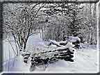 An old fashioned rail fence captued in a winter photograph.