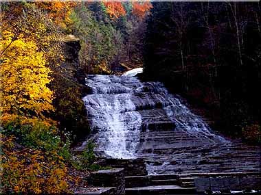 Buttermilk Falls in the autumn sunlight.