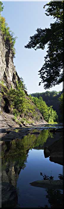 Panorama of a reflection of a cliff at Taughannock Falls.